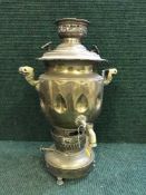 A brass tea urn