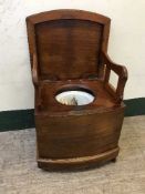 A mahogany commode armchair