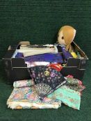 A box of hand fans, assorted fabrics and embroidery,