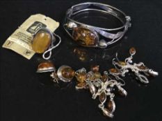 A good collection of vintage amber set jewellery comprising of bangle, dress ring,