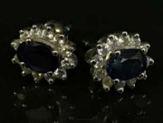 A pair of 18ct gold diamond and sapphire cluster earrings
