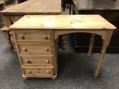 A pine desk fitted four drawers,