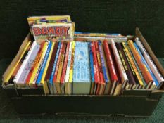 A box of Dandy and Beano annuals