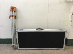 A workman's strong box and a surveyor's stand