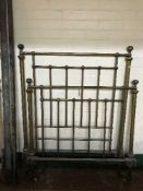 A Victorian brass bed with irons