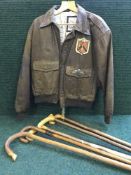 A bomber jacket and five walking sticks