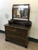 An Edwardian mirror back dressing chest