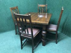 A pull out dining table and four chairs