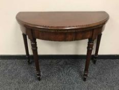 A Victorian d-shaped card table,