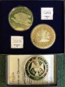 A boxed Windsor Mint Jumbo Gold Dream gold plated coin and two other similar