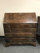 An early 19th century oak bureau,