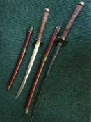 Two Samurai style swords in scabbards