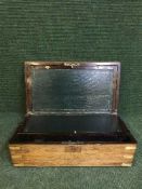 A Victorian rosewood and brass bound writing slope