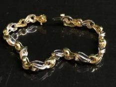 An 18ct gold sapphire and diamond bracelet, diamond weight estimated at 2.00 carats, 15.