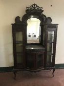 A Victorian mahogany mirror back display cabinet