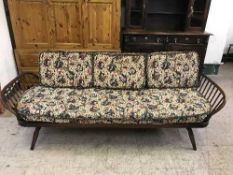 An Ercol three seater settee
