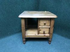 A pine lamp table fitted two drawers