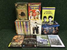 A box of DVD box sets - Laurel & Hardy,