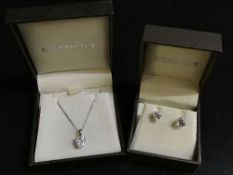 A 9ct white gold earring and necklace suite set with paste stones