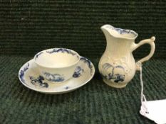 An eighteenth century English blue and white tea bowl and saucer,