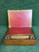 A 19th century mahogany writing slope with two inkwells