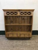 A pine wall shelf fitted two drawers