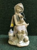 A Lladro figure - girl and puppy