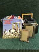 A box of assorted photograph frames, LP records,
