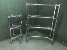 A contemporary metal and glass four tier stand and matching smaller stand