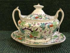 An eighteenth century English porcelain sauce tureen on stand,