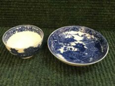 A late eighteenth century Caughley china blue and white tea bowl and saucer, saucer diameter 12 cm.