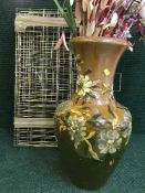 A floral decorative stone ware vase and a folding dog cage