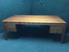 A large 1970's teak desk