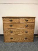 A late Victorian satin birch five drawer chest,