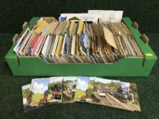A box of mixed postcards