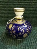 A late nineteenth century Minton gilded bulbous vase on cobalt ground, height 10.5 cm.
