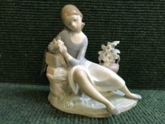 A Lladro figure - girl with flowers