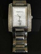 A Diamond and Co Gentleman's wrist watch, in original retail box,