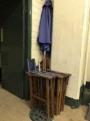 Four folding garden chairs and a parasol