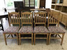 A set of four pine dining chairs