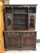 An oak sideboard fitted with shelves