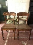 A pair of oak dining chairs