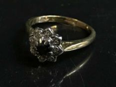 An 18ct gold sapphire and diamond cluster ring