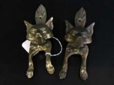 A pair of Victorian brass door knockers modelled as foxes.