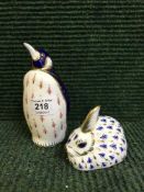 A Royal Crown Derby penguin paperweight with gold stopper and similar rabbit paperweight