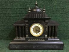 A Victorian slate mantel clock