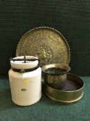 A Royal Doulton ceramic urn, embossed brass charger,