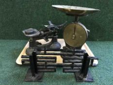 A set of vintage cast iron scales and weights