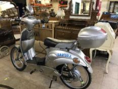 A Sakura pedal moped and key