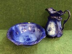 A blue glazed toilet jug and basin set